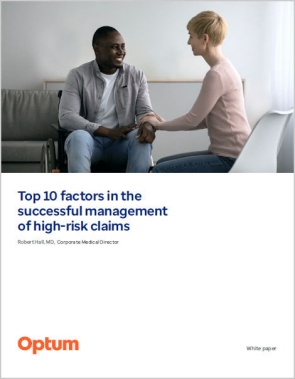 Female care giver helping male in wheelchair feel more at ease